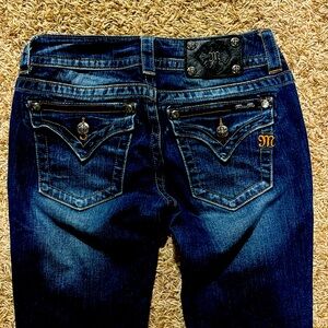 Miss Me dark wash denim jeans. Size 27, signature rise and boot cut.